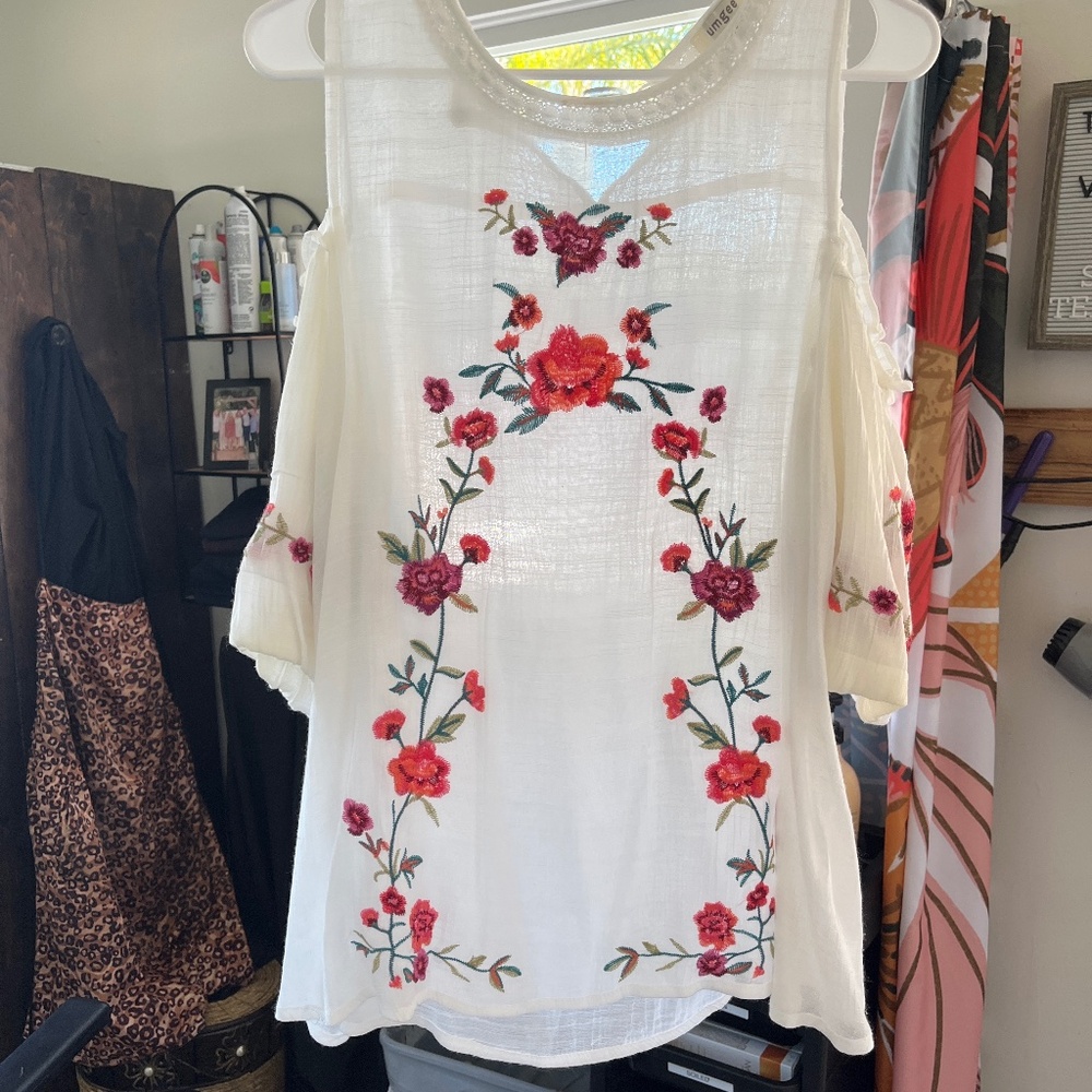 Johhny was look white shirt with pink floral pattern